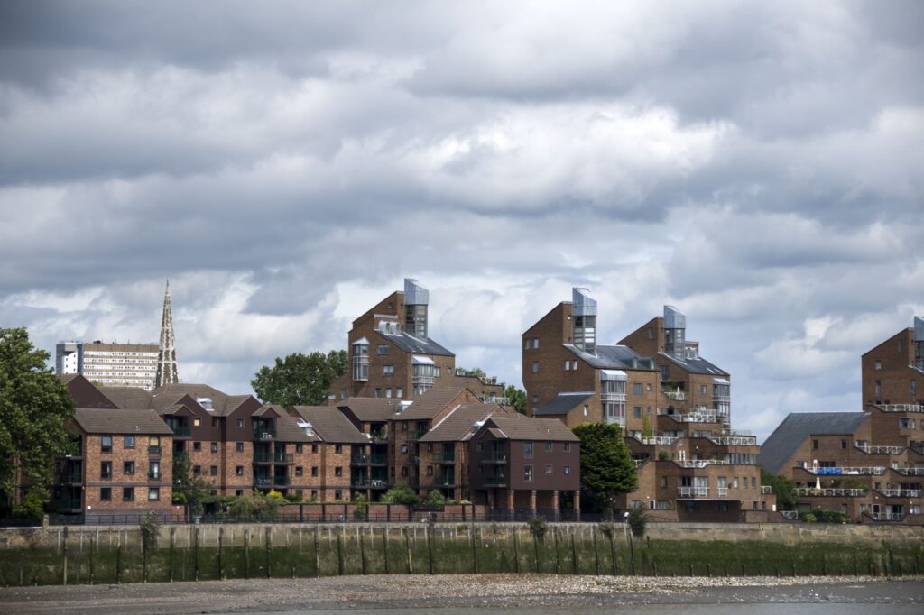 The view of brown apartment buildings from afar.