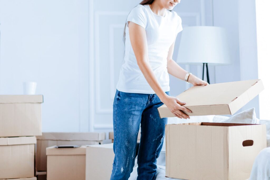 A young woman with high-quality boxes for her house move