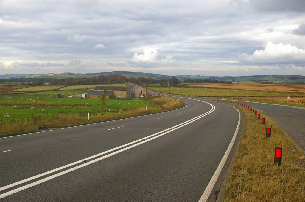 A road through the countryside in the concept of long-distance move.