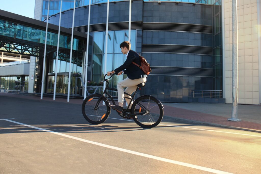 A young professional is cycling to work