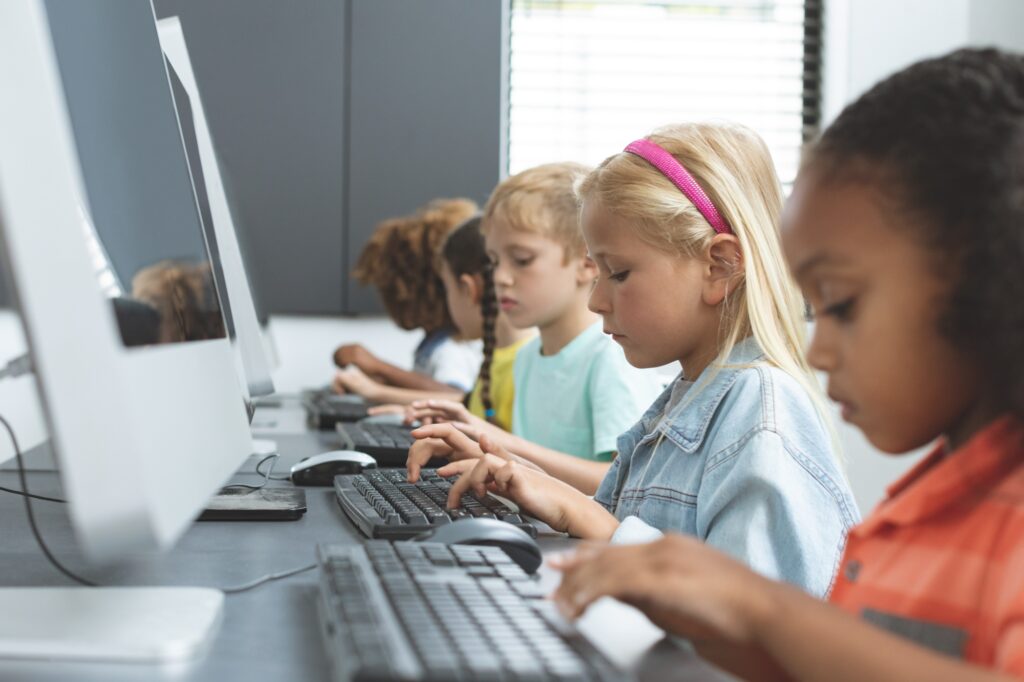 Young students in front of the computers in the concept of schools in Walthamstow.