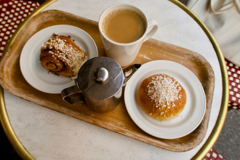 Pastries and hot coffee on the table