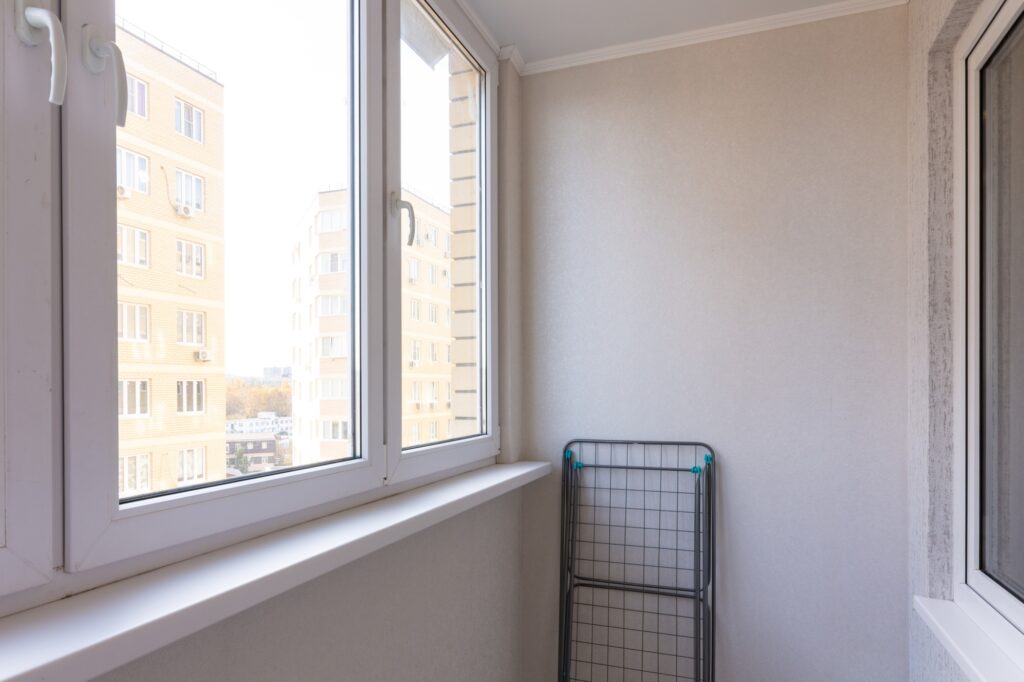 A small double-glazed window in a flat's balcony